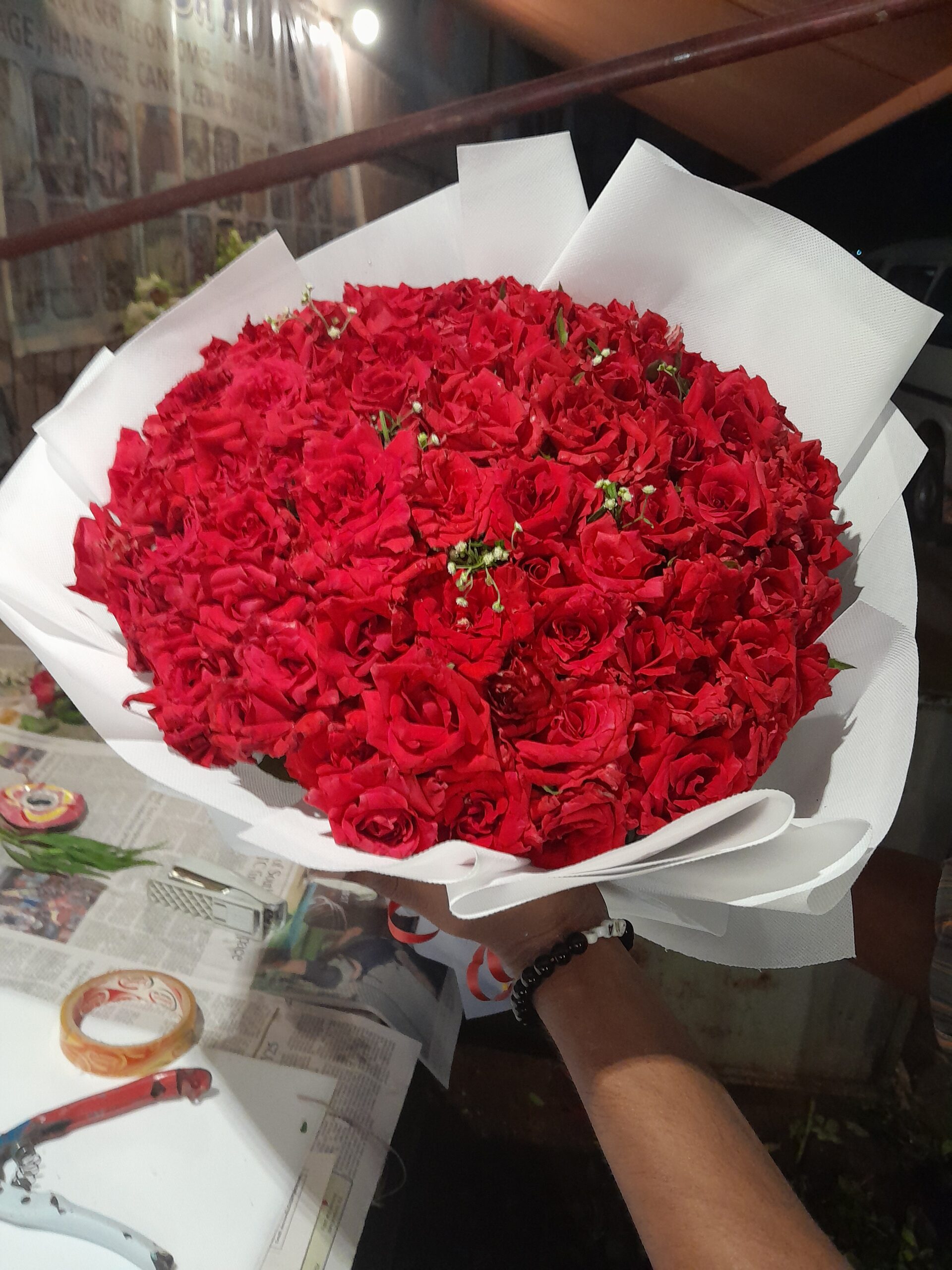 Red Roses Bouquet In white sheet
