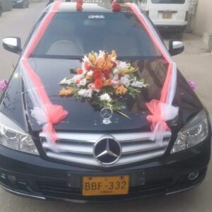 Fresh Peach and Orange Rose Centerpiece with White and Coral Tulle