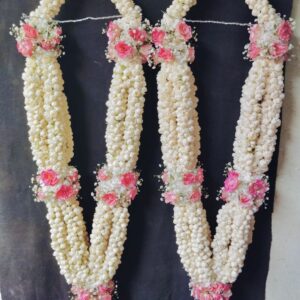 pink motiyan haar with baby breath for bride & groom